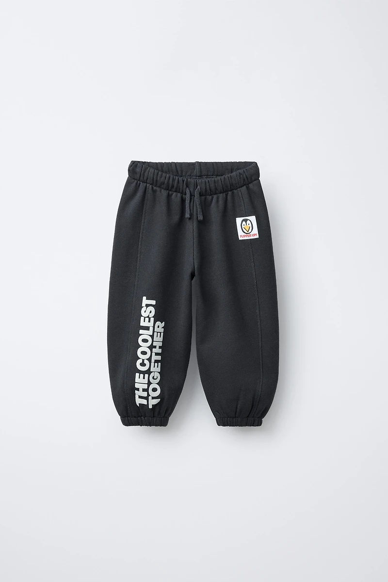 FLOCKED TEXT JOGGER PANTS