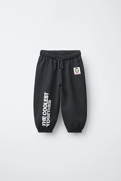 FLOCKED TEXT JOGGER PANTS