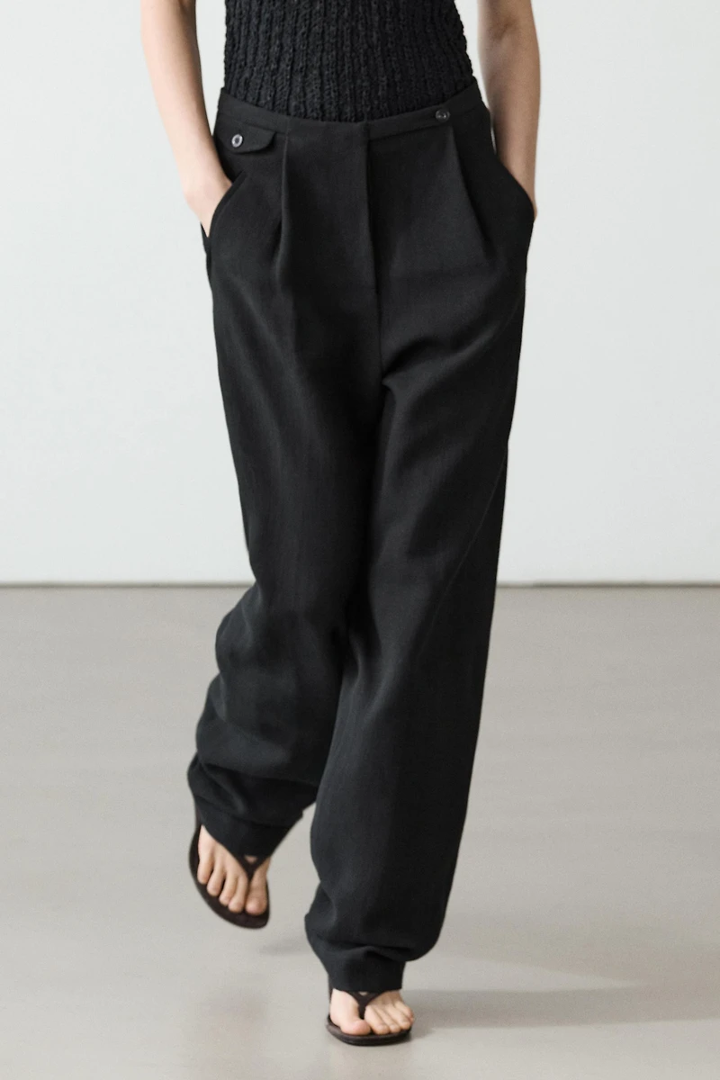 Flowing linen blend trousers with pocket details
