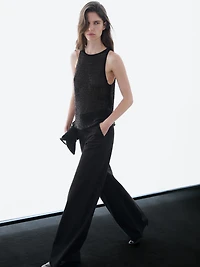 Top semi-transparent à perles fantaisie ton sur