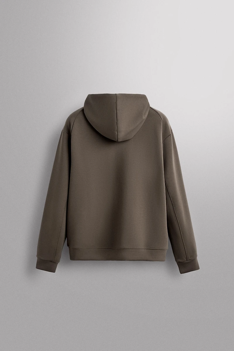 SWEAT TECHNIQUE ZIPPÉ À CAPUCHE