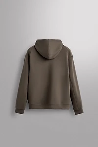 SWEAT TECHNIQUE ZIPPÉ À CAPUCHE