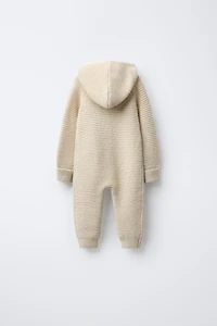HOODED CHUNKY KNIT JUMPSUIT