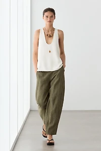 Total look linen trousers with corset belt detail
