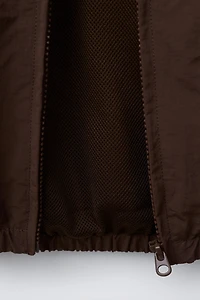 BLOUSON NYLON AVEC SAC CHAMPION ® X ZARA