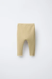 PANTS WITH CONTRASTING PIPING