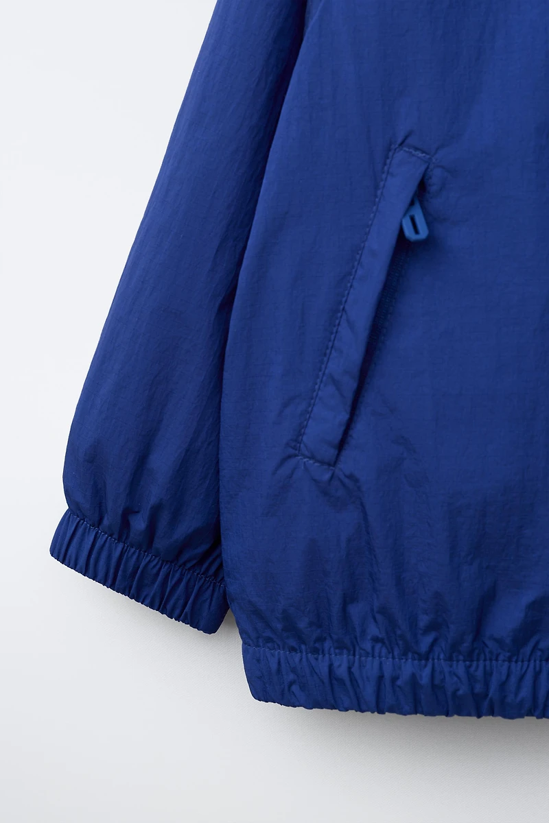 LIGHTWEIGHT WATER REPELLENT RAINCOAT