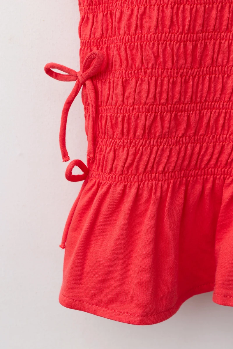 ELASTICIZED TIE TOP
