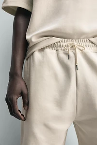 BERMUDA JOGGER RELAXED FIT INTERLOCK