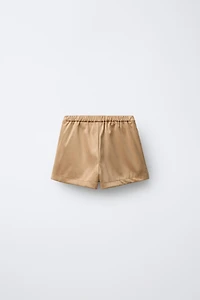 JUPE-SHORT EFFET DAIM À CLOUS