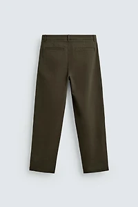 PLEATED CHINO PANTS