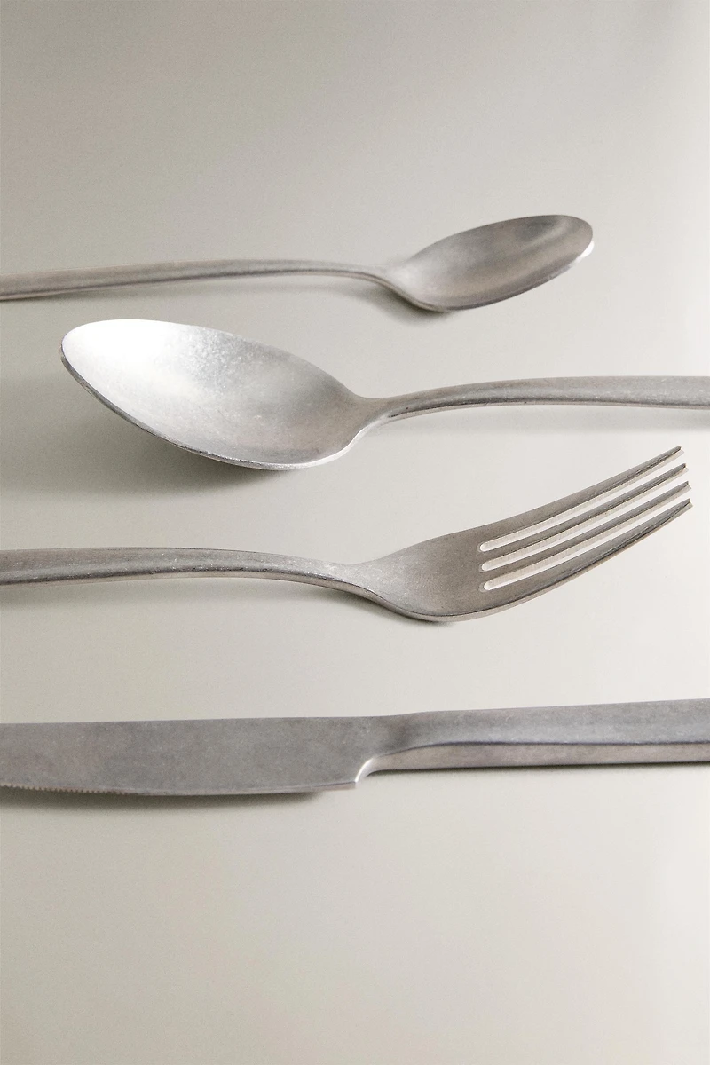 4-PIECE VINTAGE STEEL FLATWARE SET