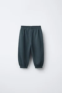 LOT DE DEUX PANTALONS JOGGING EN MOLLETON AVEC ÉTIQUETTE