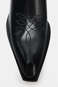 BOTTINES EN CUIR AVEC SURPIQÛRES COW-BOY