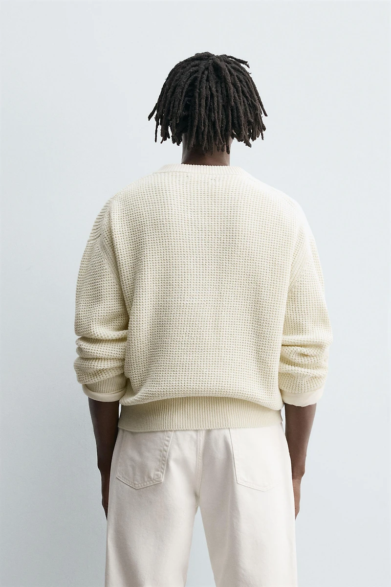RELAXED FIT BUTTON-NECK SWEATER
