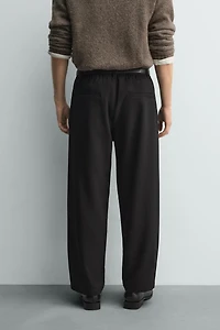 RELAXED FIT PLEATED PANTS
