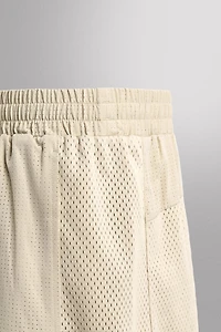 COMBINED PERFORATED SHORTS