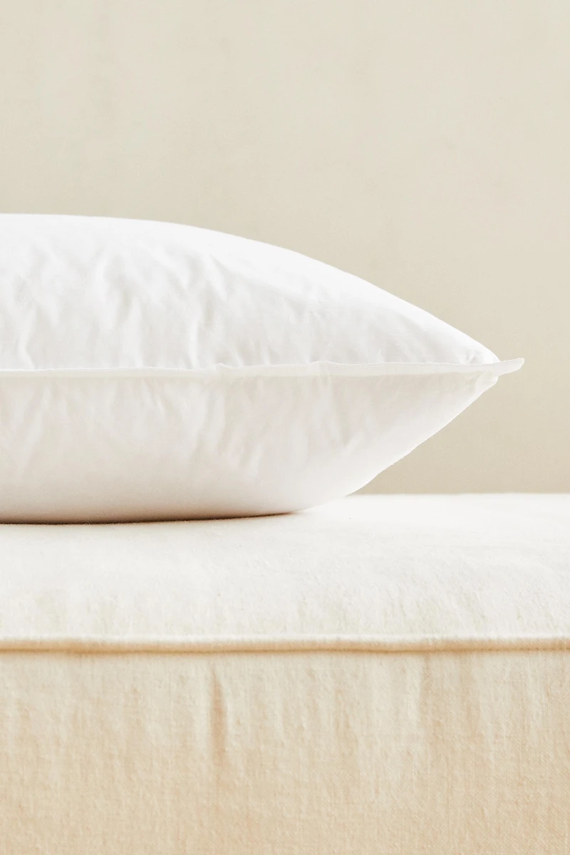 FEATHER CUSHION FILLING WITH A COTTON COVER