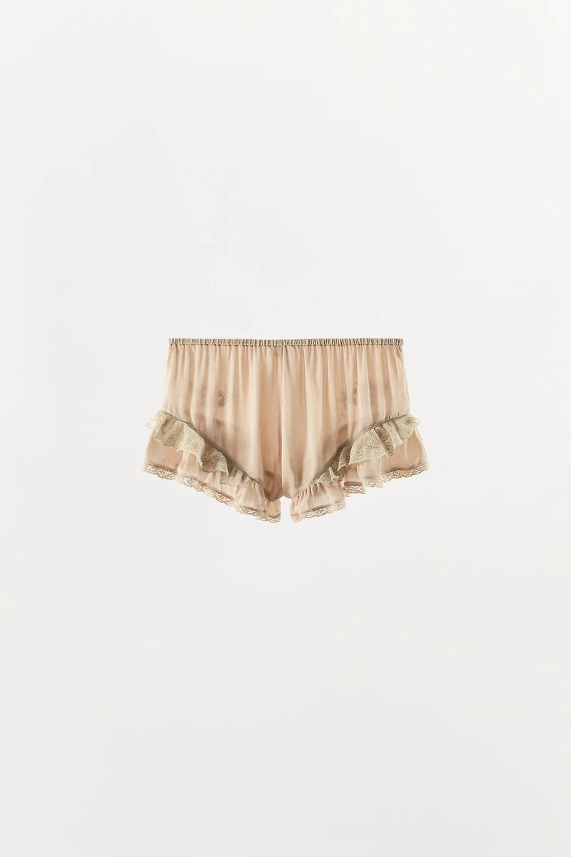 SHORT SATINÉ À VOLANTS ET FANTAISIE