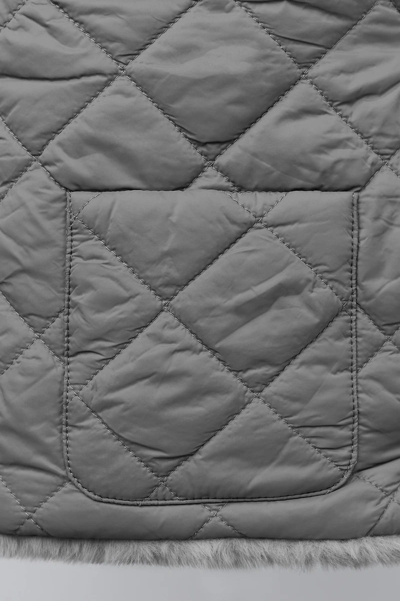GILET RÉVERSIBLE EFFET FOURRURE