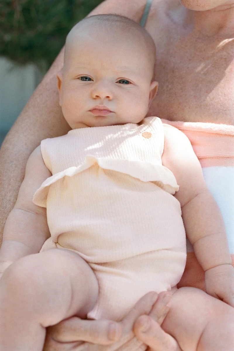 SUN EMBROIDERED RUFFLED BODYSUIT