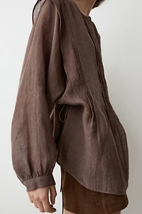 Flowing oversize linen blouse with ruffles