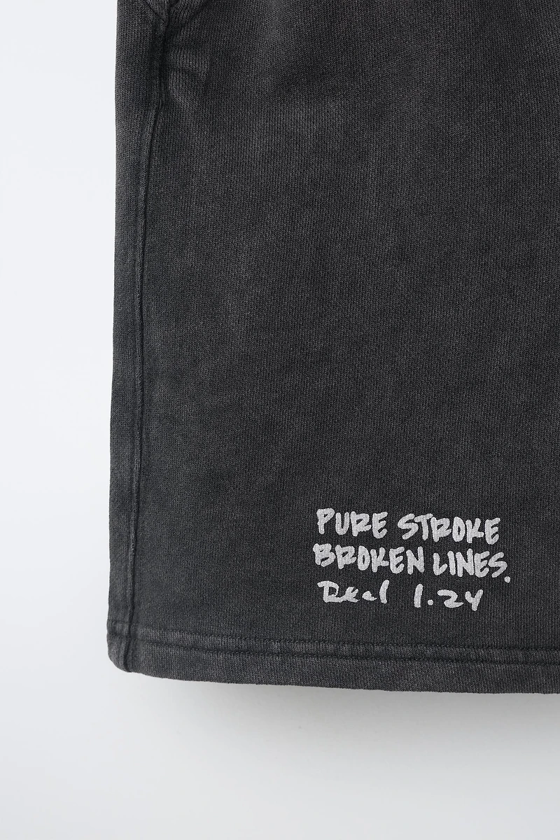 WASHED EFFECT TEXT SHORTS