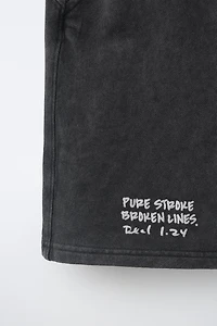 WASHED EFFECT TEXT SHORTS