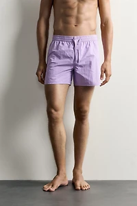 MID-LENGTH SWIMSUIT WITH VENTS