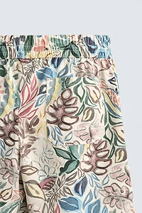 LONG FLORAL PRINT SWIM TRUNKS