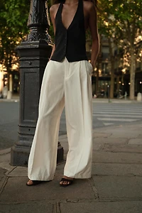 PLEATED PANTS WITH FLAPS