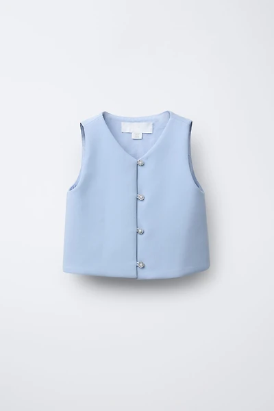 TOP AVEC BOUTON BIJOU