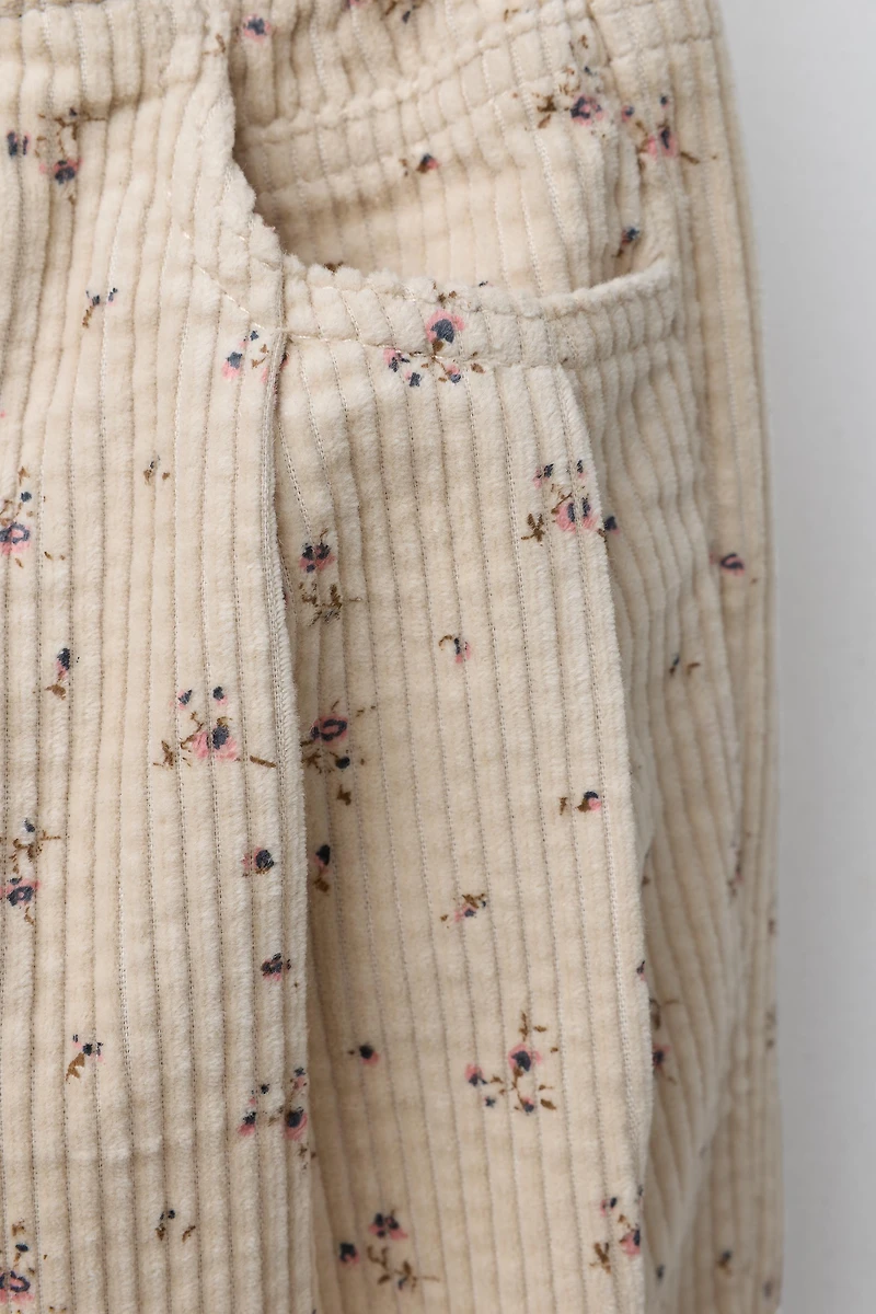 PANTALON EN VELOURS CÔTELÉ À FLEURS