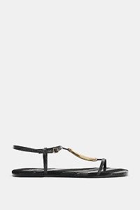 FLAT SANDALS WITH METALLIC APPLIQUÉ