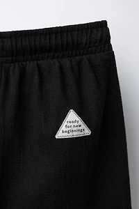 TEXTURED PANTS WITH LABEL