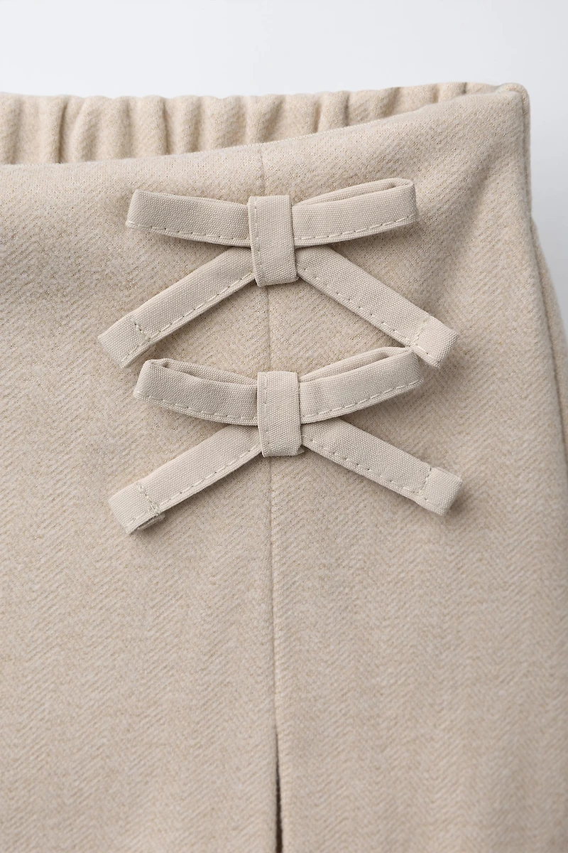 SOFT TOUCH SKORT WITH BOWS