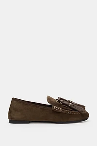 MOCASSINS EN CUIR À POMPONS