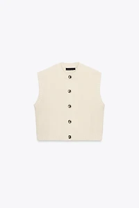 GILET EN MAILLE AVEC BOUTON DORÉ
