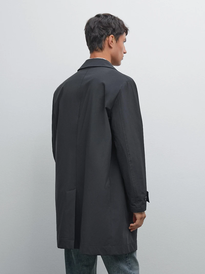 Lightweight trench coat with hidden buttons