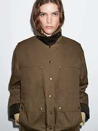 Waxed parka with corduroy detail