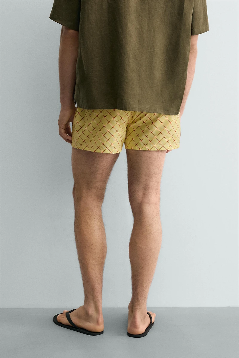 MAILLOT DE BAIN MI-LONG À IMPRIMÉ GÉOMÉTRIQUE DÉLAVÉ