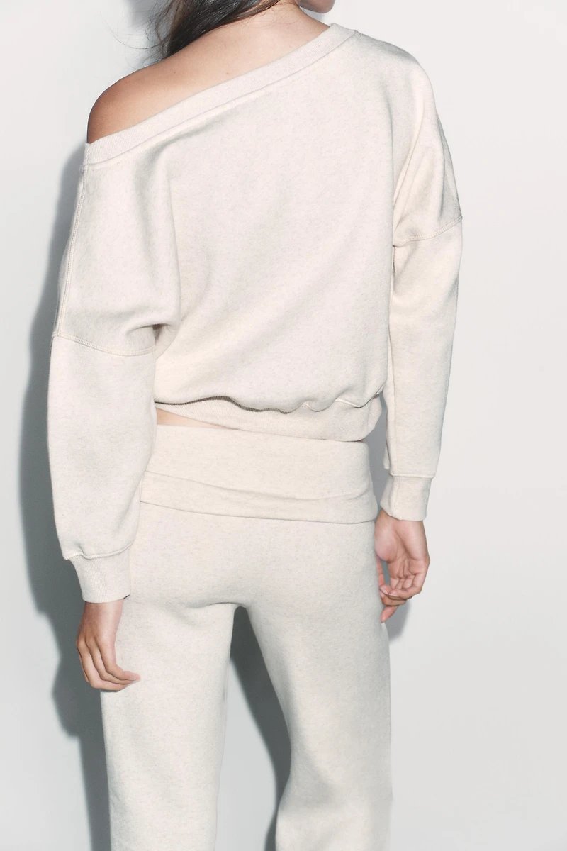 ASYMMETRIC PLUSH SWEATSHIRT