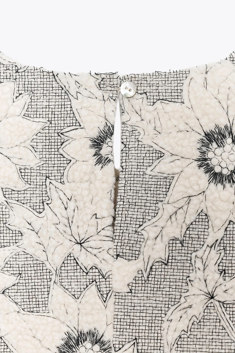 TEXTURED FLORAL PEPLUM TOP