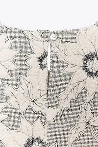 TEXTURED FLORAL PEPLUM TOP