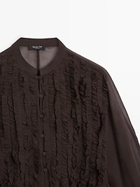 Flowing bib-front shirt with ruffles