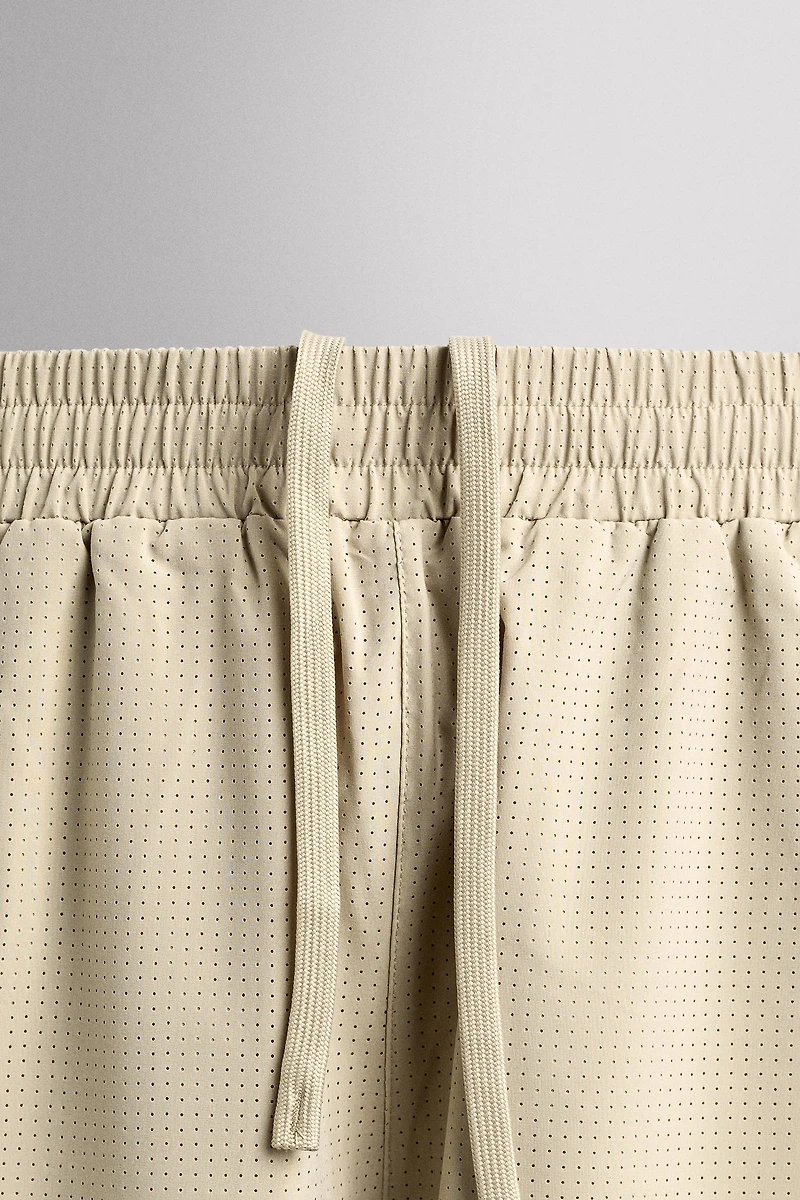 COMBINED PERFORATED SHORTS