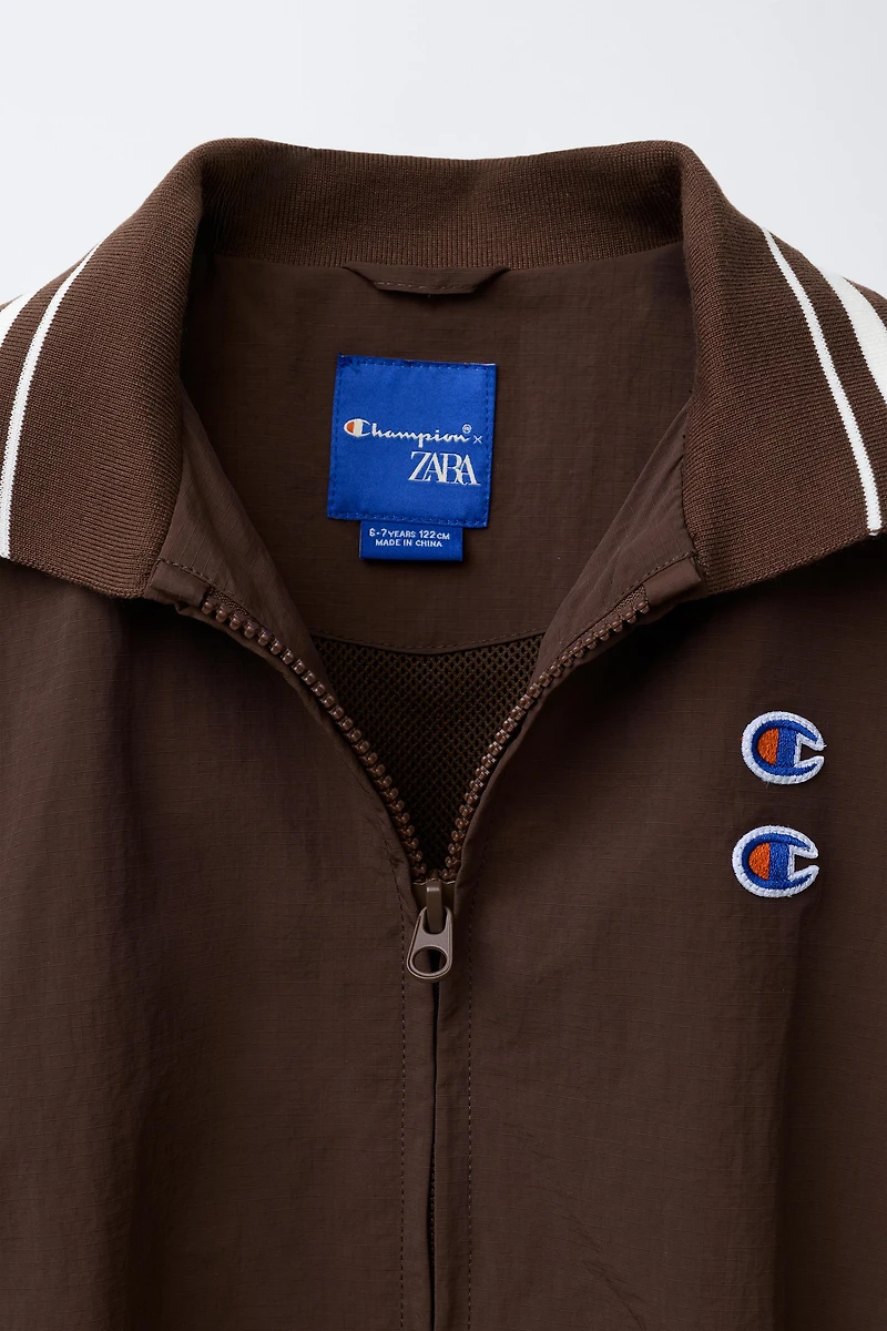 BLOUSON NYLON AVEC SAC CHAMPION ® X ZARA