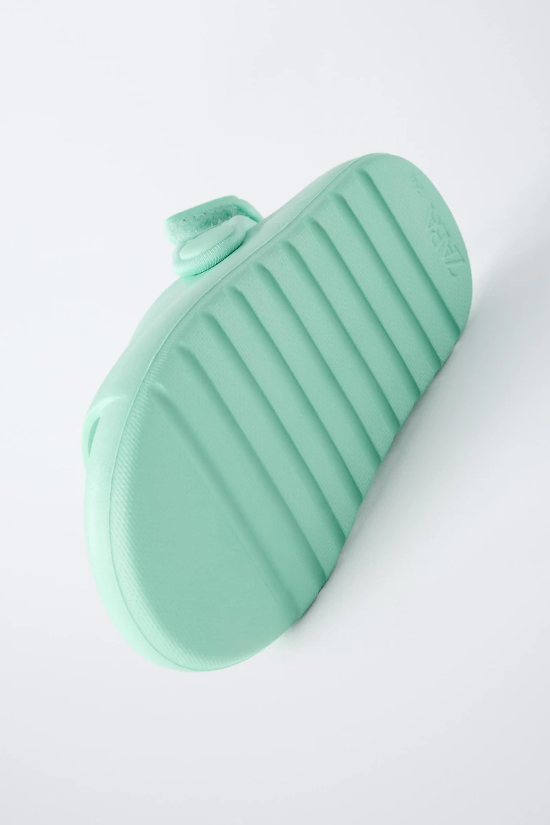 RUBBERIZED SLIDES