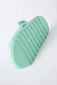 RUBBERIZED SLIDES
