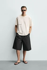 CONTRASTING PATCH TEXT T-SHIRT